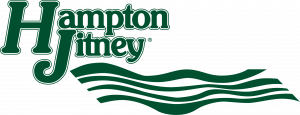 Logo for Hampton Jitney - company name is in dark green with the H in Hampton and J in Jitney much larger than the rest of the text. Four dark green uneven wavy lines are below the text.